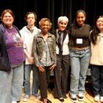 A group of students and school staff pose for a photo together